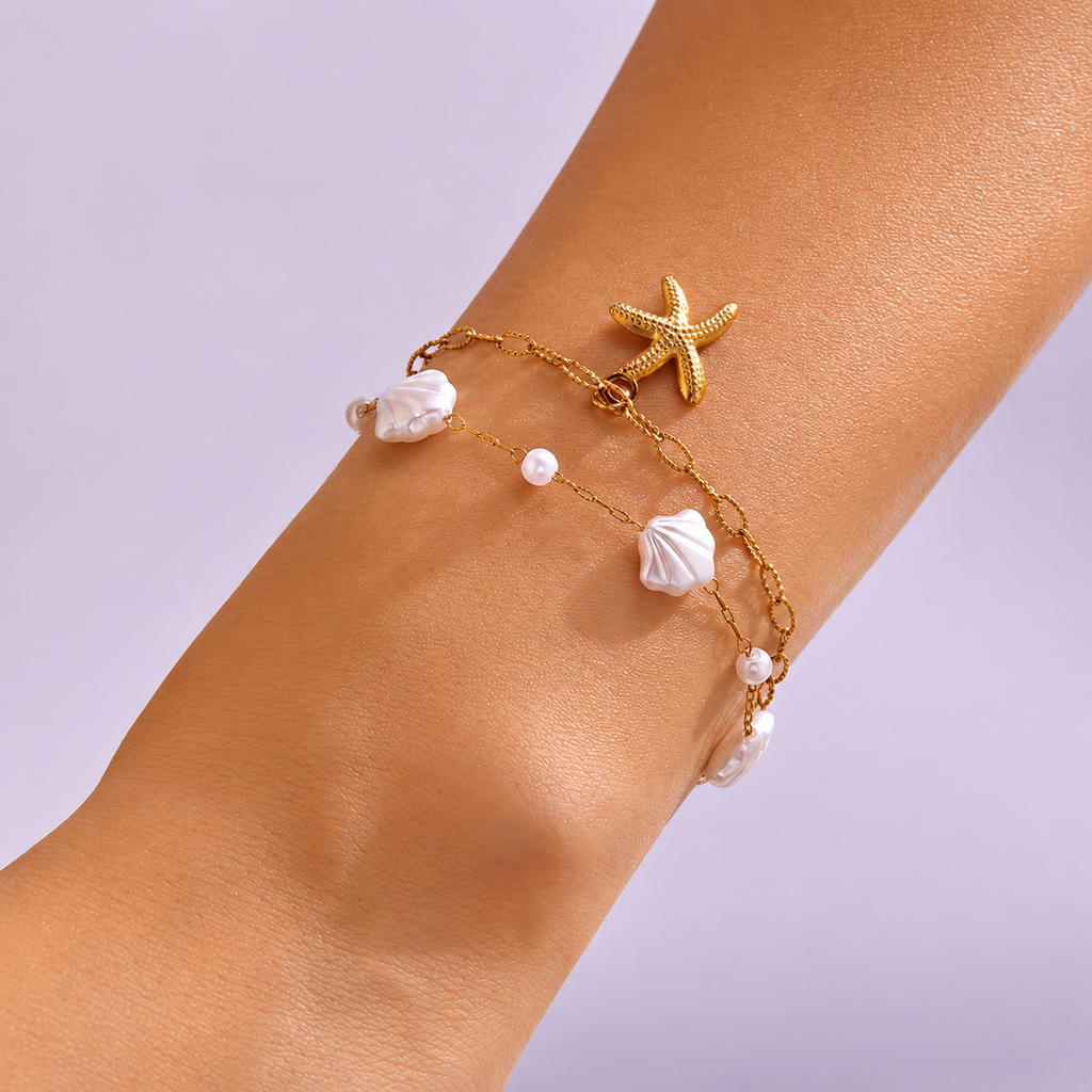 Elegantes Edelstahl‑Armband mit Seestern, Perle & Muschel