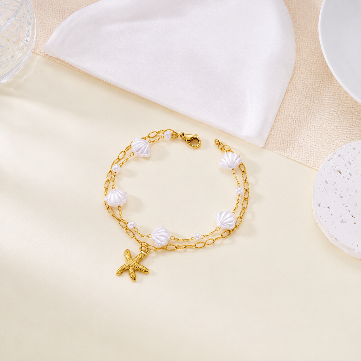 Elegantes Edelstahl‑Armband mit Seestern, Perle & Muschel