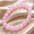 Elegantes rosafarbenes Naturstein Perlenarmband für Damen mit glänzender Oberfläche und zeitlosem Design