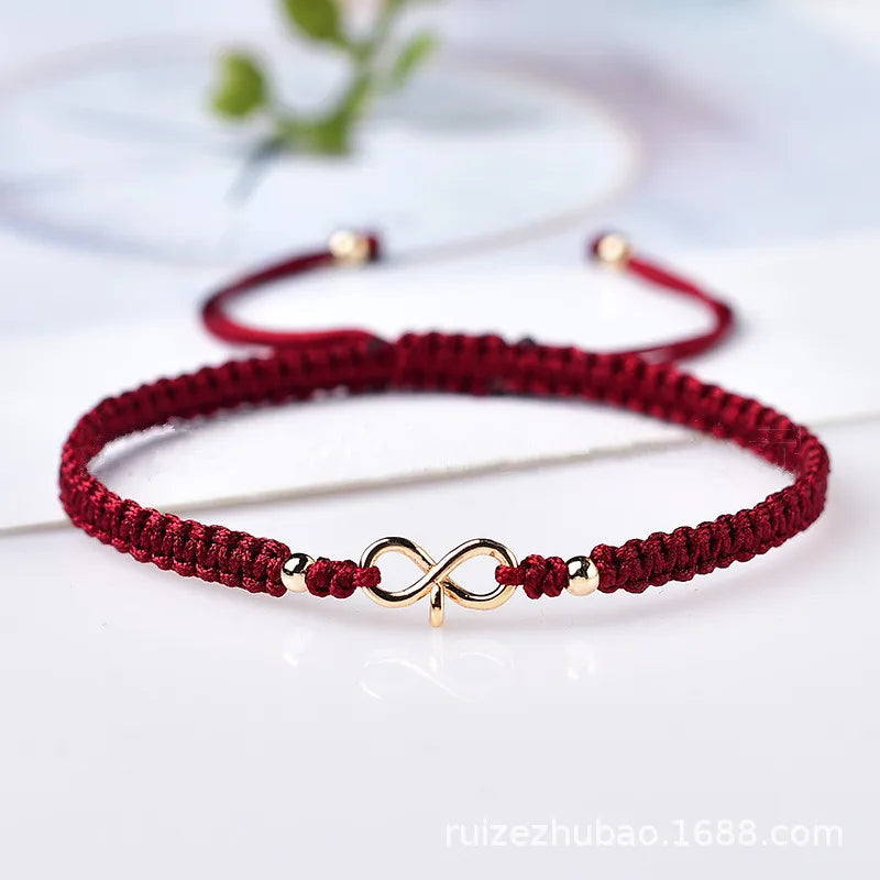 Natürliches Infinity Symbol Glücksarmband aus rotem Rope handgefertigt mit verstellbarer Glücksperle