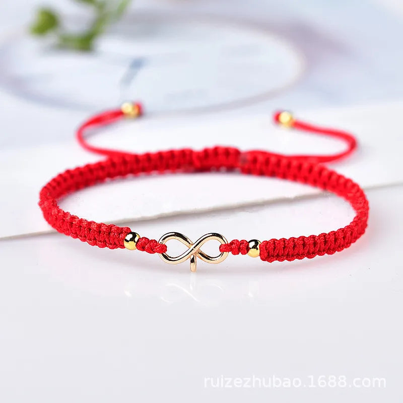 Natürliches Infinity Symbol Glücksarmband aus rotem Rope handgefertigt mit verstellbarer Glücksperle