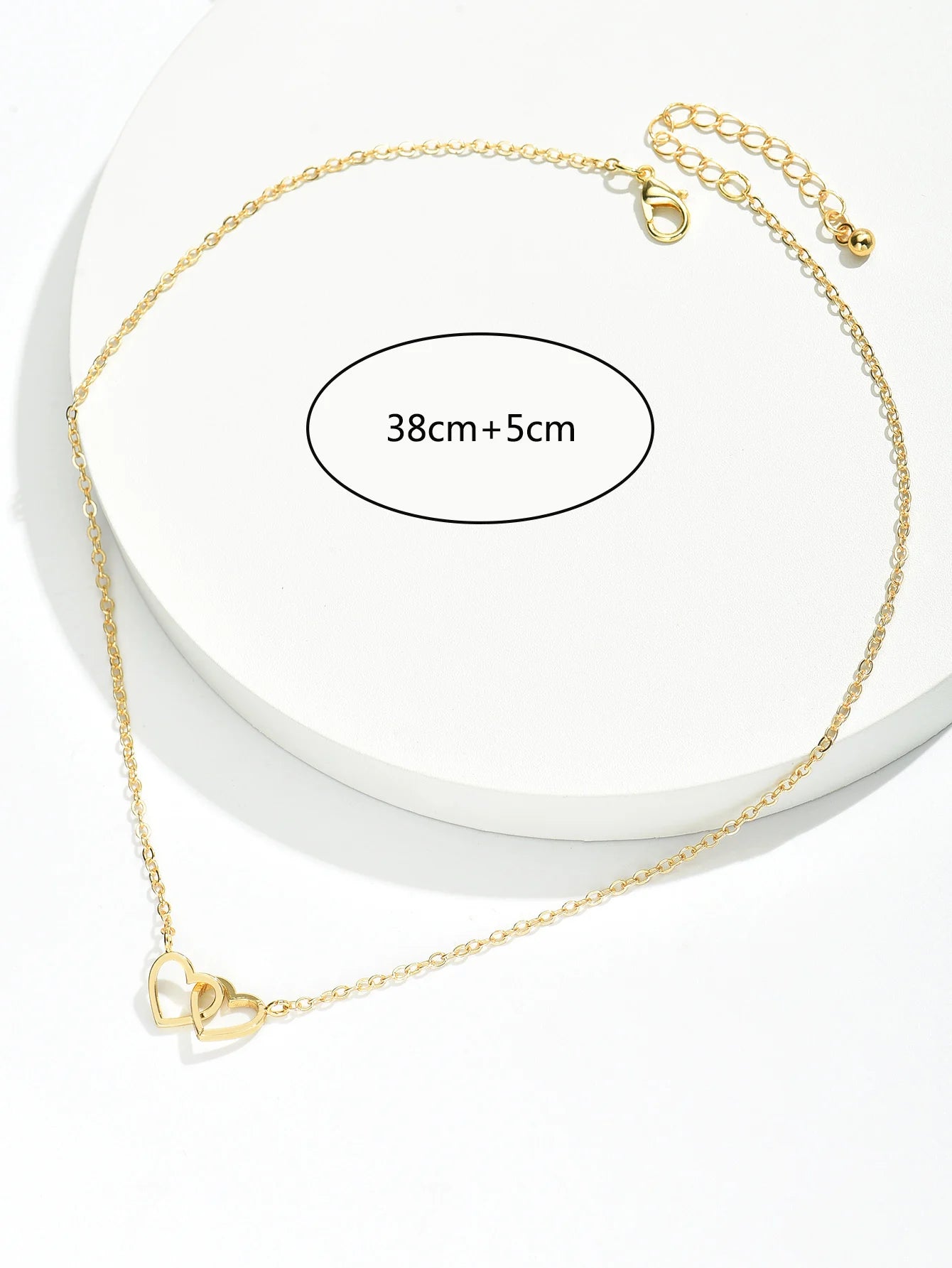 Feine Damenkette mit zwei hohlen Herzmotiven im minimalistischen Design