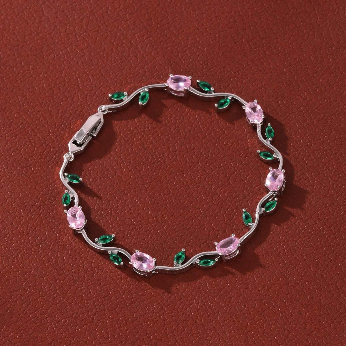 Zartes Armband mit tulpenrosa Zirkonia und filigranen Rankenblumen