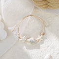 Sommerliches Strandarmband mit Muscheln & Perlen