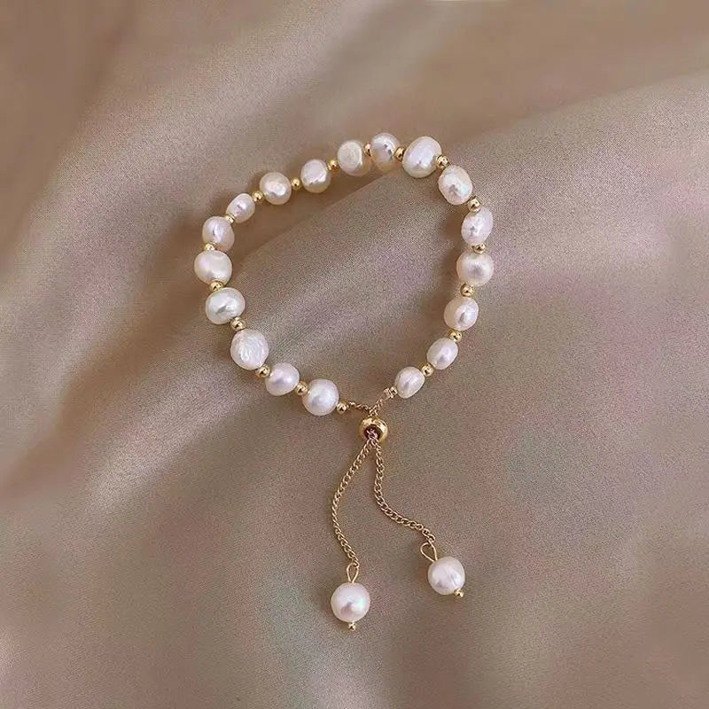 Damen‑Armband mit lila Imitationsperlen und Kristall‑Akzenten