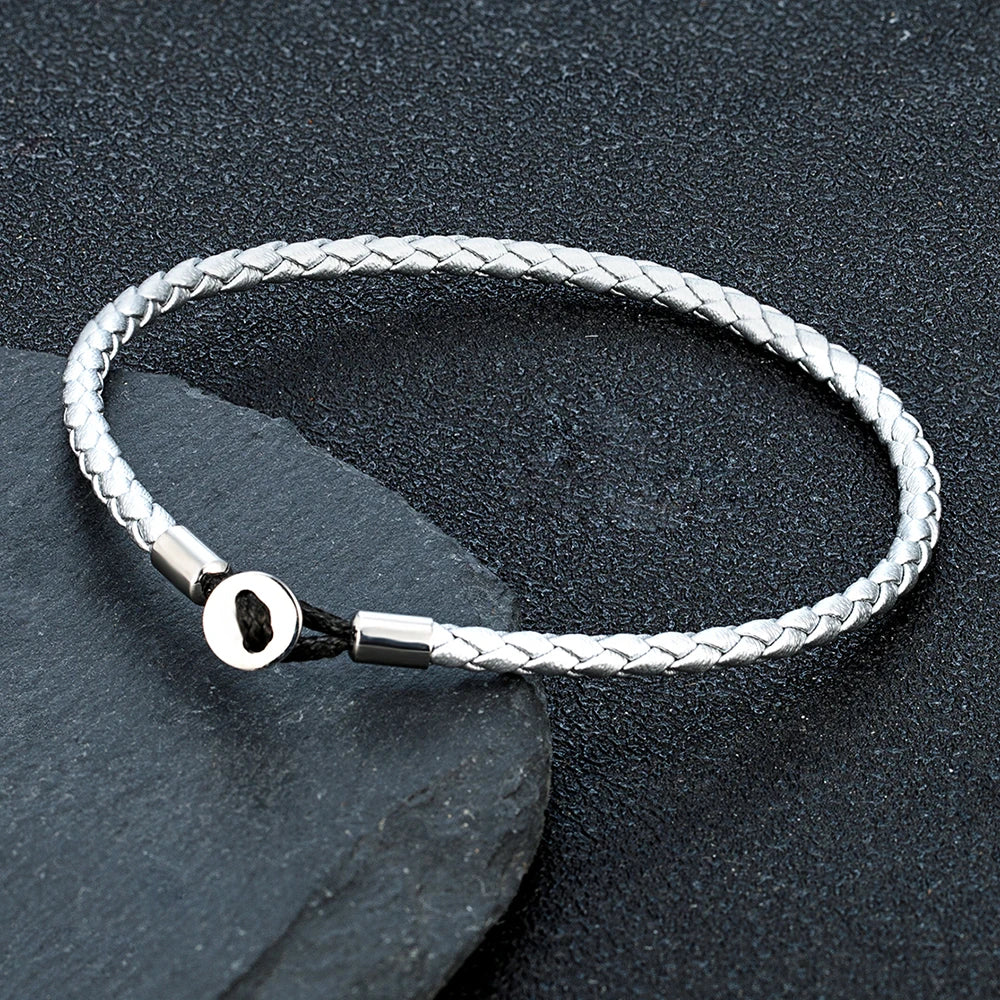 Geflochtenes Lederarmband mit Edelstahl‑Knopf