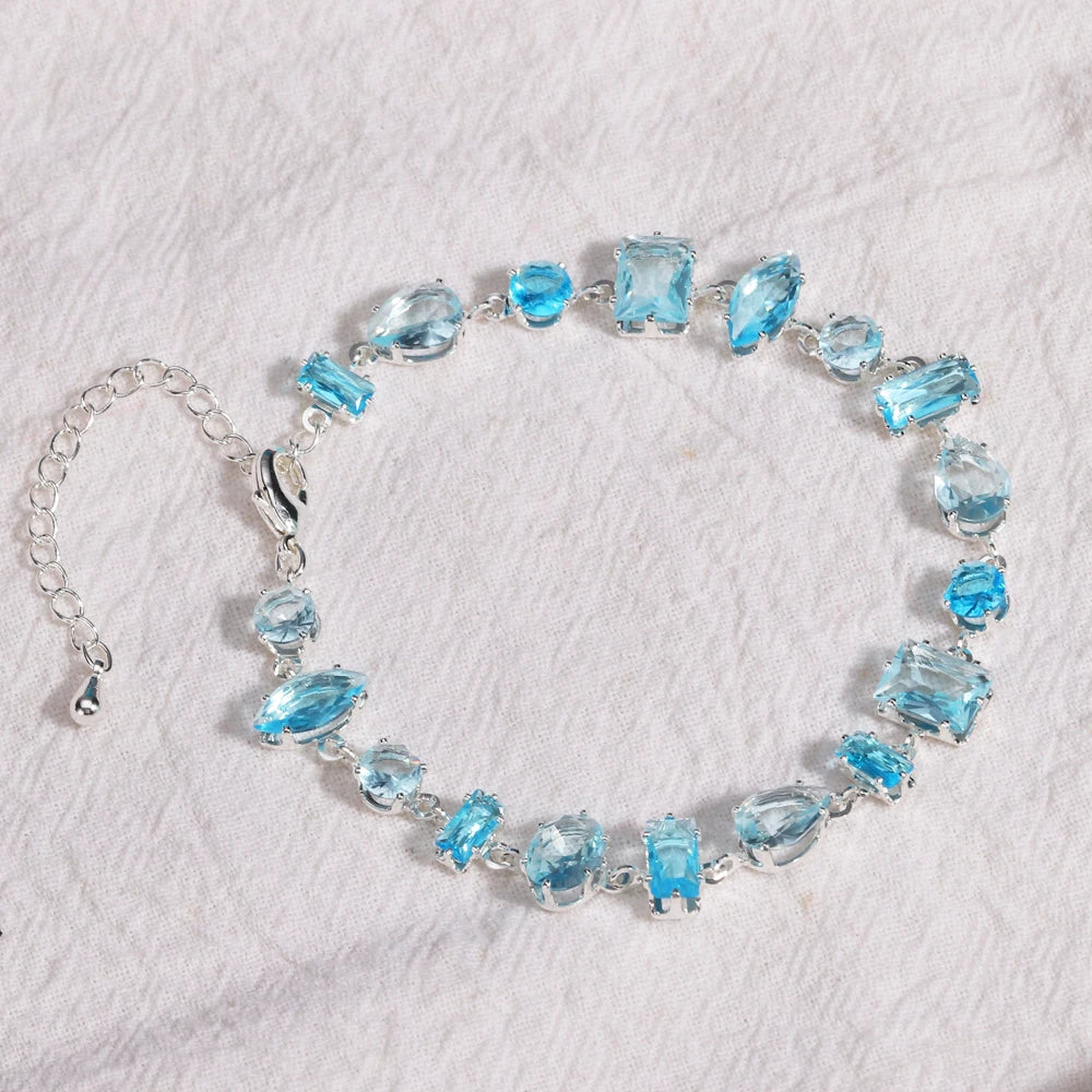 Elegantes Tennisarmband in Violett und Blau mit Zirkonia und modernem Geometry Look